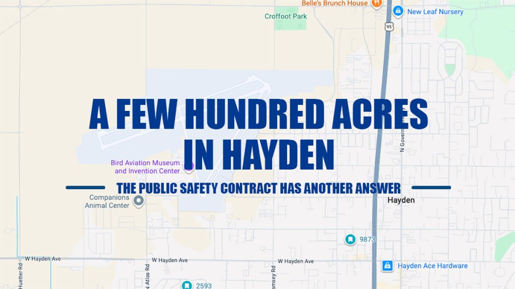 Map background of Hayden showing street layouts and landmarks, overlaid with bold blue text reading "A FEW HUNDRED ACRES IN HAYDEN: THE PUBLIC SAFETY CONTRACT HAS ANOTHER ANSWER."